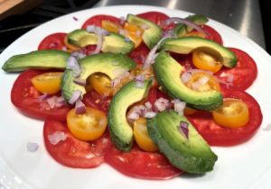 Avocado on top of Tomatoes